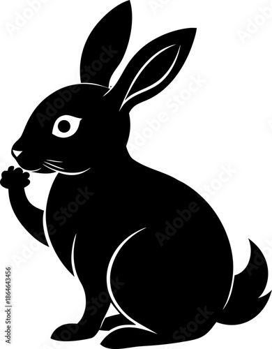 Solid black silhouette of a rabbit sitting and sniffing the air, white background.