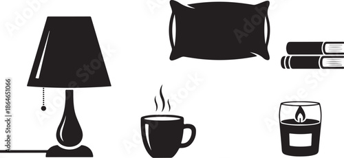 Cozy bedroom setup with lamp, books, and hot beverage