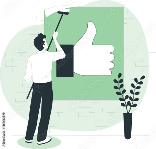 Man hanging a large illustration of a thumbs up on a brick wall