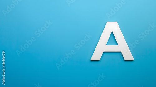 Capital Letter A on Blue: A crisp, white capital letter A stands out against a vivid blue backdrop, symbolizing a fresh start, aspiration, or the foundational element of any endeavor.