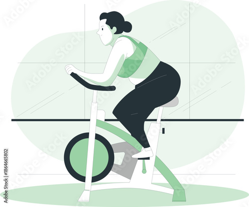 Woman exercising on a stationary bicycle in a modern fitness studio with a calm atmosphere
