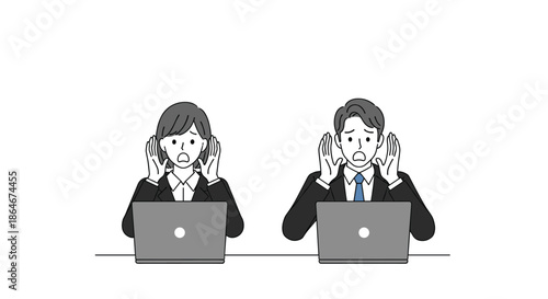 Two business professionals look shocked and distressed while working on their laptop computers representing technical issues or bad news.