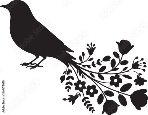Black bird silhouette perched on a flowering branch