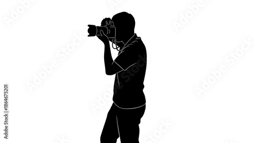 Silhouette of a photographer taking a picture with a camera