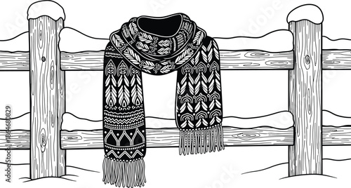 Cozy winter scarf on rustic wooden fence with snow