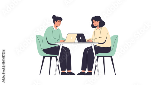 two women engaged in a professional discussion and working on laptops at a round table in a modern