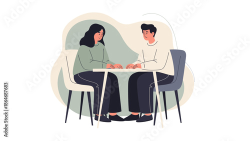 Two people having a conversation while seated at a table in a calm setting