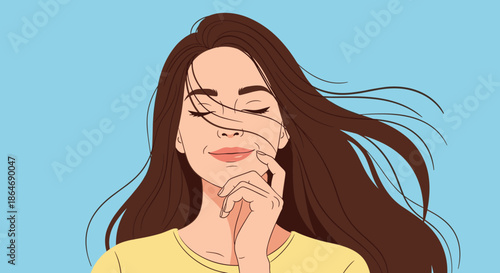 Serene portrait of a beautiful woman with long brown hair gently blowing across her face against a clear blue sky during a windy day.