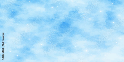 A bright and beautiful summer day features a clear blue sky with fluffy white clouds and natural sunlight creates an abstract cloudscape across the heaven-like atmosphere of this natural background