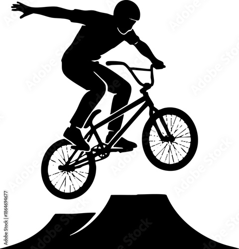 Black Silhouette of BMX Rider Jumping Bike Off Ramp