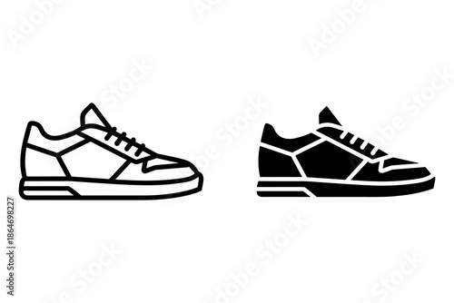 A pair of sneakers in black and white colors on a plain background