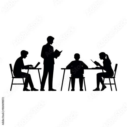 A group of students sitting at desks with a teacher standing nearby in a classroom setting.