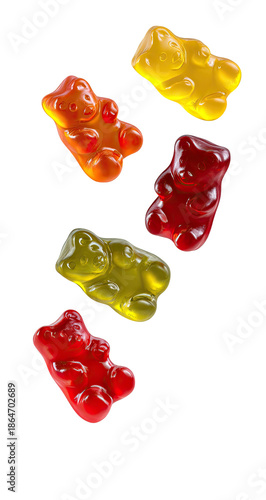 Colorful gummy bears falling against a black background