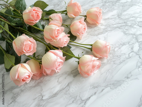 Pink rose bouquet delicate petals on marble surface conveying romantic softness and gentle mood