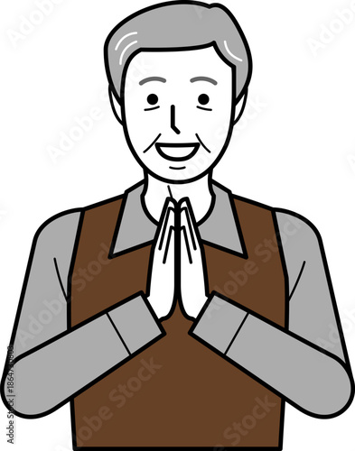 正面向き。いただきますと手を合わせるシャツとベストを着た高齢男性。