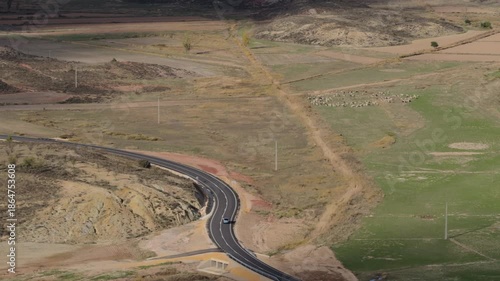 Wallpaper Mural Aerial S-Curve Road Across Dry Farmland With Car and Sheep Torontodigital.ca