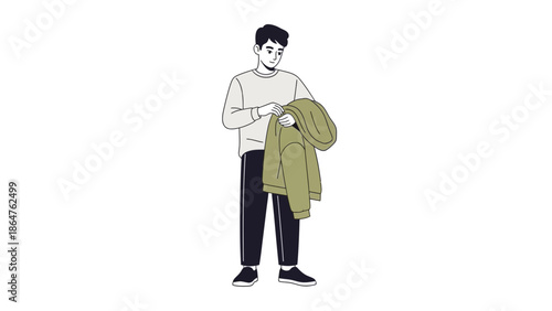 Young man in casual clothing holding a jacket and looking at his phone isolated on white background