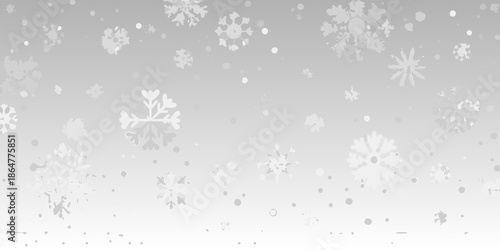 Gentle snowfall A grayscale image featuring delicate scattered snowflakes descending