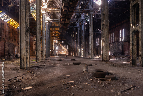 Abandoned factory hall with concrete columns