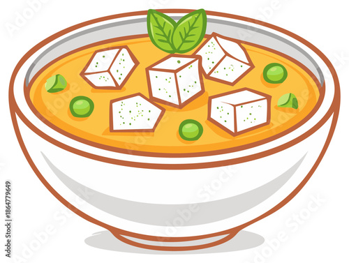 Creamy Yellow Curry with Tofu and Peas in a White Bowl