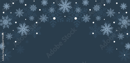 Falling White Snowflakes on Dark Blue Winter Night Backdrop