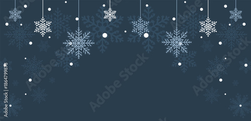 Hanging White and Blue Snowflakes on Dark Background