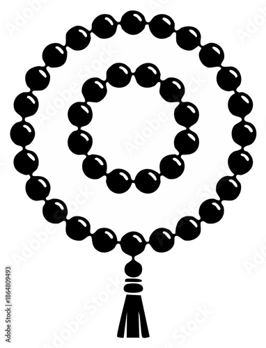 Black prayer beads arranged in a spiral with a tassel