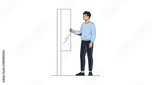 Young man pressing elevator button with reflection on glass panel for modern building interior