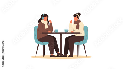 Two women enjoying a conversation at a coffee shop with headphones and warm clothing