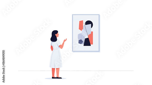 A woman in a white dress stands before a framed abstract artwork, gesturing toward it. The background is a plain white wall