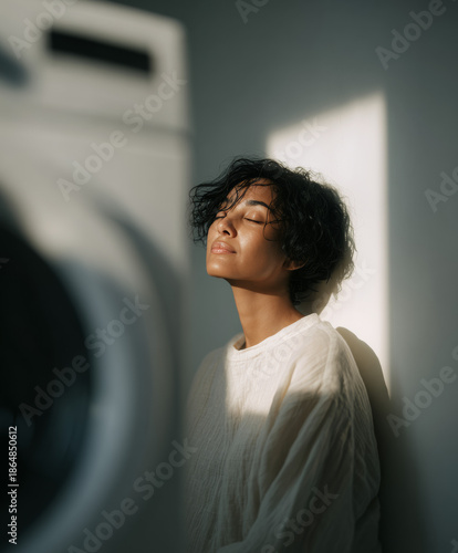 Serene Moment: Woman Practicing Mindfulness and Deep Breathing in a Sunlit Minimalist Room