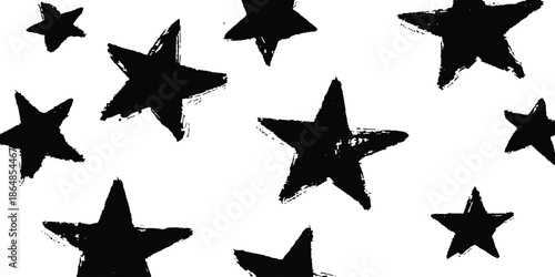 A simple, grunge-style pattern of black stars on a white background. A hand-drawn, grunge-style pattern featuring various sizes of black stars on a simple white background. 