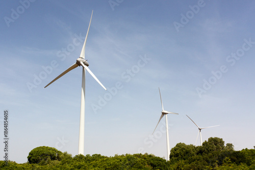 Wind turbine on a green landscape, Andalusia, Spain