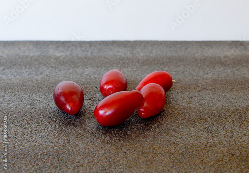 Large ripe dogwood berries close-up on a dark background.