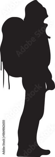 Silhouette of a person carrying a large backpack hiking