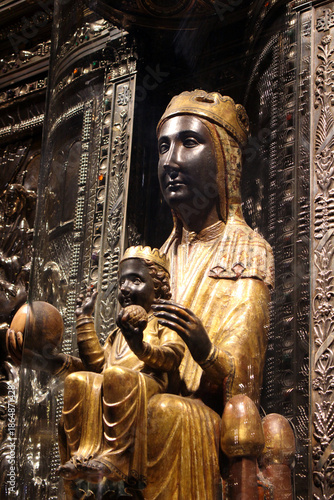 Statue of the Black Madonna holding the orb and the Child Jesus inside the Basilica of Santa Maria de Montserrat, taken in July 2024.