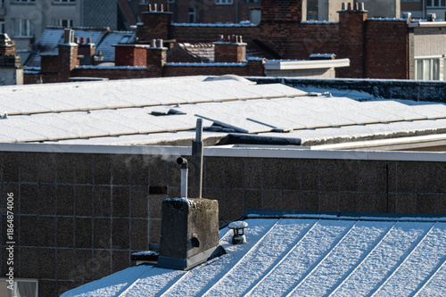 Rooftops and terraces covered with snow, high angle view of Jette, brussels Capital Region, Belgium.