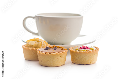 Tableau sur toile Sweet mini tartlets and coffee cup isolated on white background.