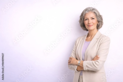 Mature businesswoman with grey hair smiling confidently