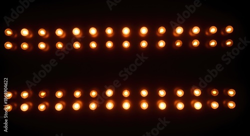 Abstract background of glowing marquee bulbs forming a brilliant, warm texture suitable for drama or entertainment design uses ,shimmer ,grid ,light
