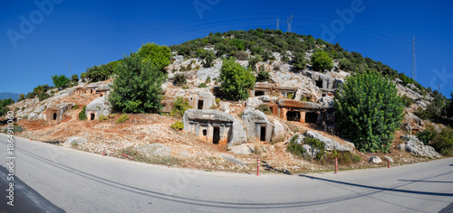 The ancient Lycian rock tombs of Demre (Myra) are carved into the red cliffs: facades with Doric columns and pilasters over terraces, a classic symbol of Lycian culture in Turkey