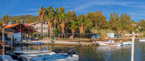 The ancient Lycian rock tombs of Demre (Myra) are carved into the red cliffs: facades with Doric columns and pilasters over terraces, a classic symbol of Lycian culture in Turkey