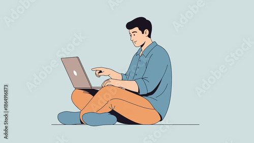 Young man seated cross-legged using a laptop in a relaxed home setting emphasizing technology and