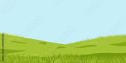 A simple illustration of green grassy hills against a clear blue sky