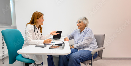 Photos Female ophthalmologist describing eye treatment and medical procedure to old pat