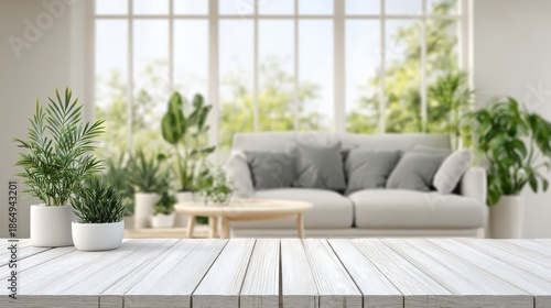 Bright and Airy Modern Living Room with Green Plants, Comfortable Couch, and Natural Light Streaming through Large Windows