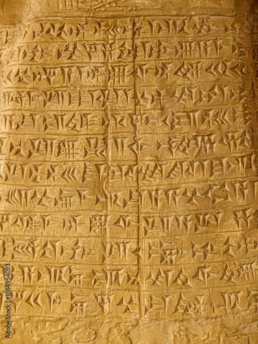 Cuneiform writing on a clay tablet on display in a museum in Mosul, Iraq