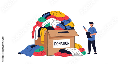 Man organizing a clothing donation, standing by a large cardboard box overflowing with used garments for charity and recycling.