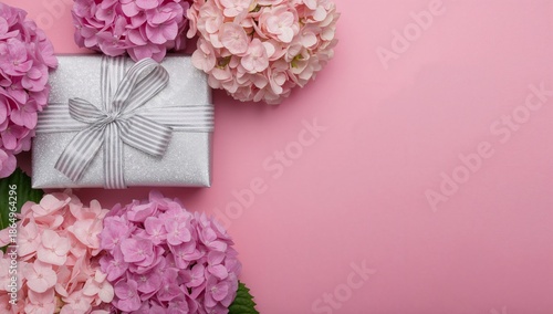 Pink Flowers and a Gift on a Simple Surface for a Special Occasion Celebration