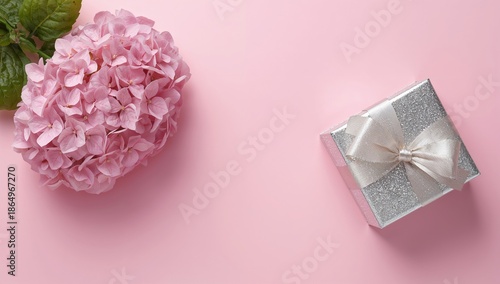Pink Flowers and a Gift on a Simple Surface for a Special Occasion Celebration